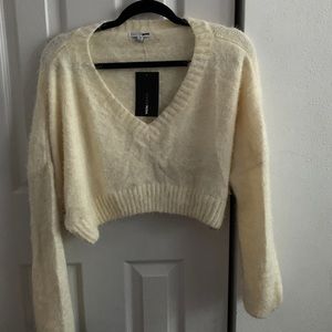 Never worn cream colored cropped sweater